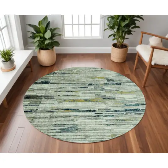 8' Ivory and Blue Round Abstract Area Rug Photo 1