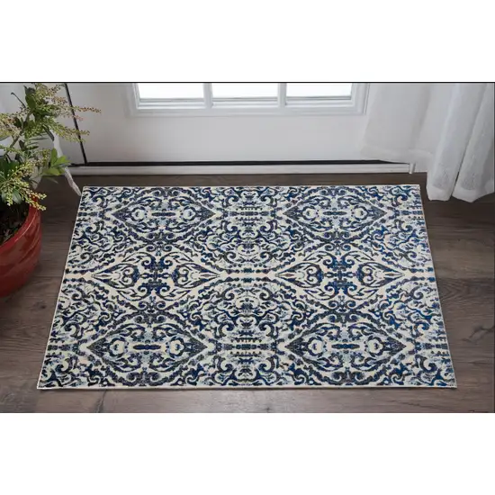 Blue Ivory And Black Floral Distressed Stain Resistant Area Rug Photo 1