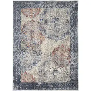 Photo of Blue Ivory And Red Floral Power Loom Distressed Stain Resistant Area Rug