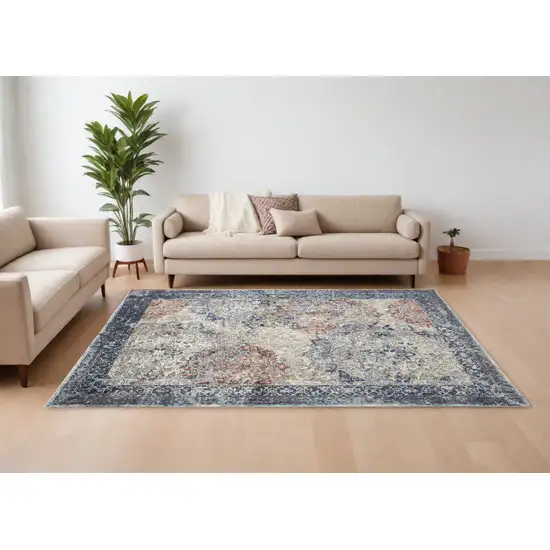 Blue Ivory And Red Floral Power Loom Distressed Stain Resistant Area Rug Photo 1