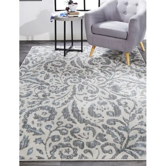 Blue Ivory And Tan Floral Distressed Stain Resistant Area Rug Photo 7