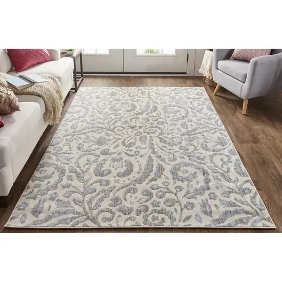 Blue Ivory And Tan Floral Distressed Stain Resistant Area Rug Photo 6