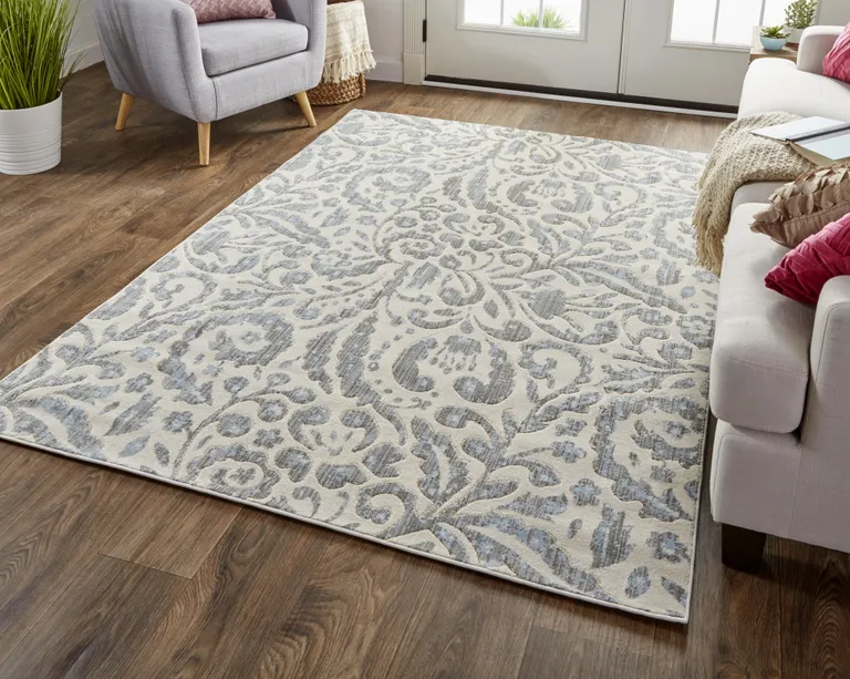 Blue Ivory And Tan Floral Distressed Stain Resistant Area Rug Photo 5