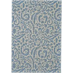 Photo of Blue Ivory And Tan Floral Distressed Stain Resistant Area Rug