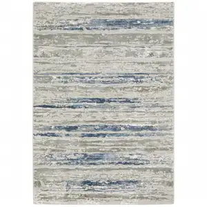 Photo of Blue Ivory Grey Light Blue And Brown Abstract Power Loom Stain Resistant Area Rug