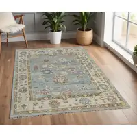 Photo of Blue Ivory and Yellow Wool Floral Hand Knotted Area Rug With Fringe