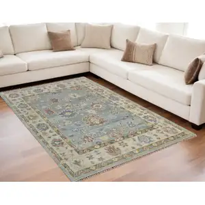 Photo of Blue Ivory and Yellow Wool Floral Hand Knotted Area Rug With Fringe