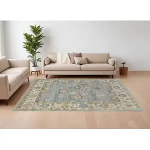 Photo of Blue Ivory and Yellow Wool Floral Hand Knotted Area Rug With Fringe