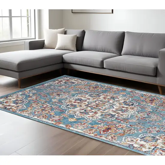 Ivory Blue and Orange Medallion Power Loom Area Rug Photo 1