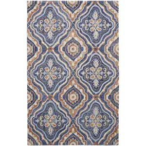 Photo of Blue Orange And Ivory Wool Geometric Tufted Handmade Stain Resistant Area Rug