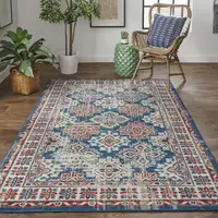 Photo of Blue Red And Ivory Abstract Power Loom Distressed Stain Resistant Area Rug