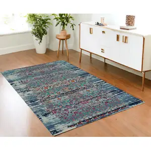 Photo of Blue Red And Orange Floral Distressed Area Rug