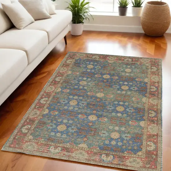 Blue and Beige Floral Hand Woven Distressed Area Rug Photo 1