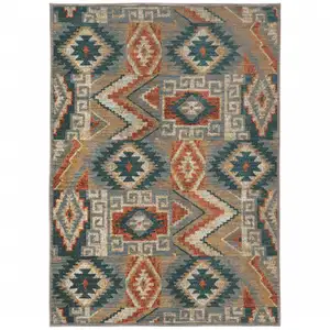 Photo of Blue Teal Grey Orange Gold Ivory And Rust Geometric Power Loom Stain Resistant Area Rug