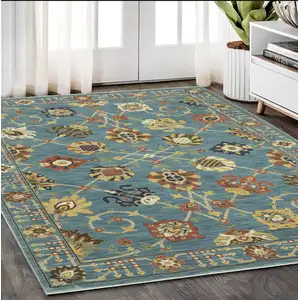 Photo of Blue Yellow And Ivory Oriental Area Rug With Fringe