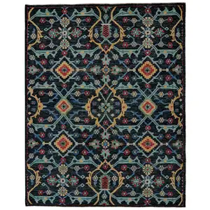 Photo of Blue Yellow And Red Wool Floral Hand Knotted Distressed Stain Resistant Area Rug With Fringe