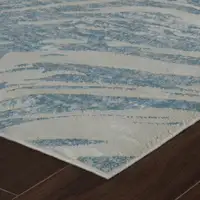 Photo of Blue and Beige Abstract Distressed Area Rug