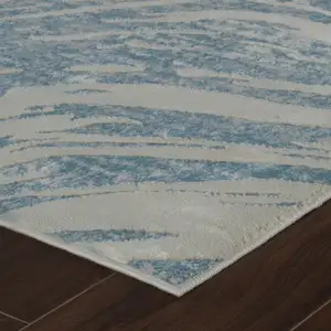 Photo of Blue and Beige Abstract Distressed Area Rug