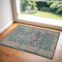 Photo of Blue and Beige Floral Distressed Area Rug