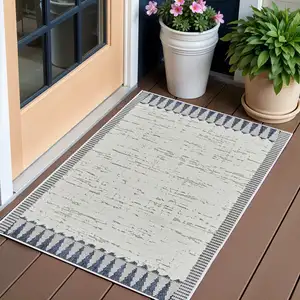 Photo of Blue and Cream Abstract Distressed Indoor Outdoor Area Rug