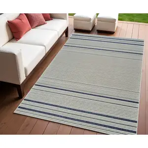 Photo of Blue and Cream Striped Distressed Indoor Outdoor Area Rug