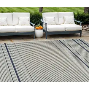 Photo of Blue and Cream Striped Distressed Indoor Outdoor Area Rug