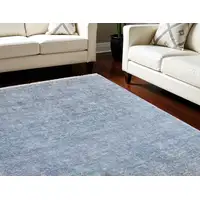 Photo of Blue and Gray Abstract Hand Woven Distressed Area Rug With Fringe