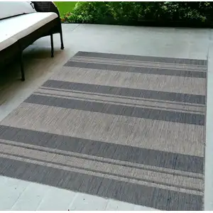 Photo of Blue and Gray Striped Stain Resistant Indoor Outdoor Area Rug