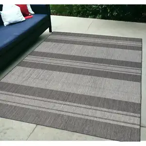 Photo of Blue and Gray Striped Stain Resistant Indoor Outdoor Area Rug