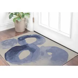 Photo of Blue and Ivory Abstract Hand Tufted Area Rug