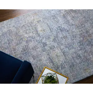 Photo of Blue and Ivory Abstract Hand Woven Distressed Area Rug With Fringe