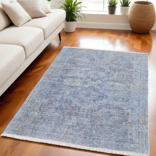 Blue and Ivory Abstract Hand Woven Distressed Area Rug With Fringe Photo 1