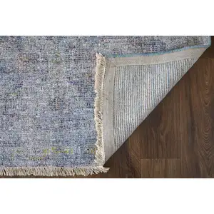 Photo of Blue and Ivory Abstract Hand Woven Distressed Area Rug With Fringe