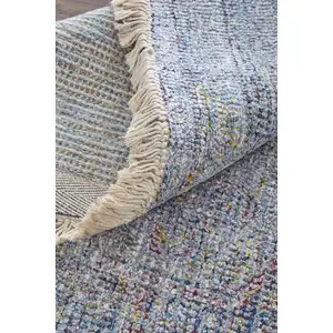 Photo of Blue and Ivory Abstract Hand Woven Distressed Area Rug With Fringe