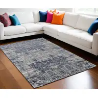 Photo of Blue and Ivory Abstract Hand Woven Worn Faded Area Rug