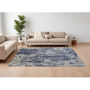 Photo of Blue and Ivory Abstract Hand Woven Worn Faded Area Rug