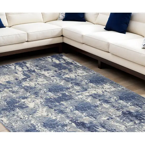 Blue and Ivory Abstract Power Loom Area Rug Photo 1