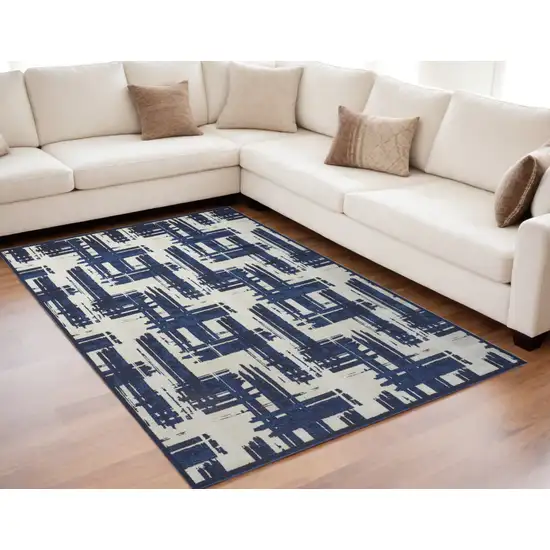 Blue and Ivory Abstract Power Loom Area Rug Photo 1