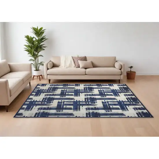 Blue and Ivory Abstract Power Loom Area Rug Photo 1