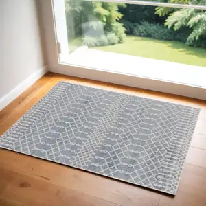 Photo of Blue and Ivory Abstract Power Loom Washable Area Rug