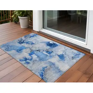 Photo of Blue and Ivory Abstract Washable Non Skid Indoor Outdoor Area Rug