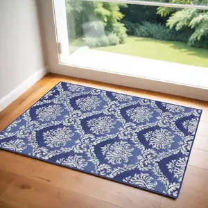 Photo of Blue and Ivory Damask Distressed Area Rug