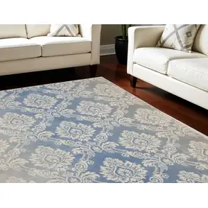 Photo of Blue and Ivory Damask Distressed Non Skid Area Rug