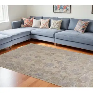 Photo of Blue and Ivory Floral Hand Knotted Area Rug