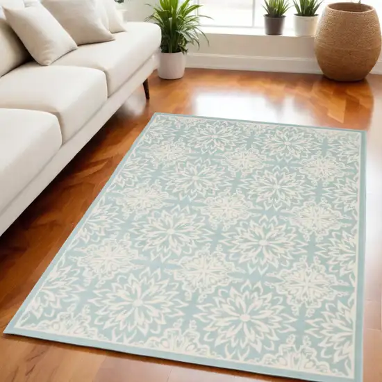 Blue and Ivory Floral Medallion Power Loom Area Rug Photo 1