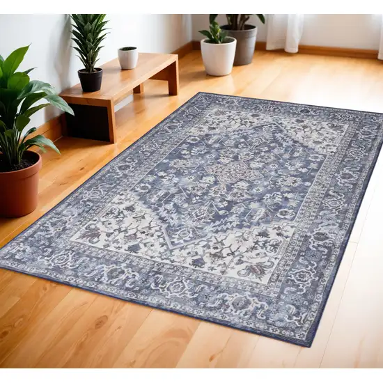 Blue and Ivory Floral Medallion Power Loom Distressed Area Rug Photo 1