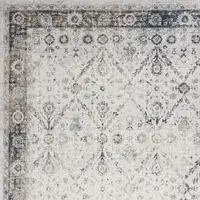 Photo of Blue and Ivory Floral Medallion Power Loom Distressed Washable Area Rug