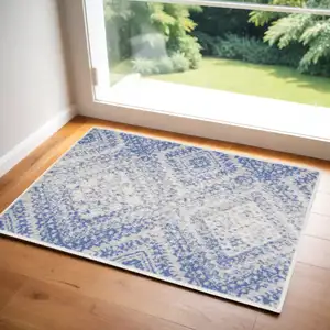 Photo of Blue and Ivory Geometric Distressed Area Rug