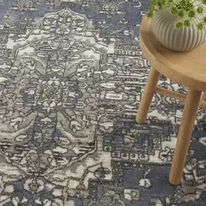 Photo of Blue and Ivory Medallion Power Loom Distressed Area Rug