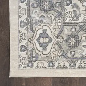 Photo of Blue and Ivory Medallion Power Loom Distressed Area Rug